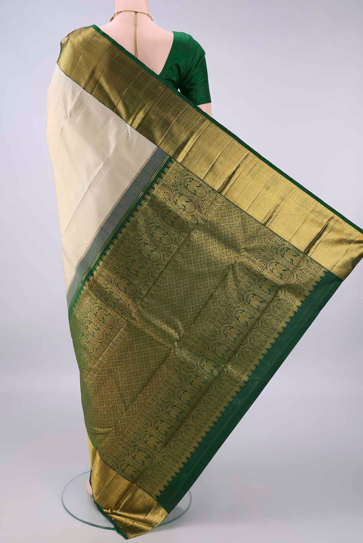 Flat view of Pure Silk Cream Kanchipuram Saree with Checked design on the body and Zari Border. 