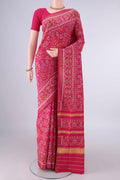 Pure Silk Rani Pink Rajkot Patola Saree with Pure Ikat on the body and Ikat Border.  displayed on a mannequin