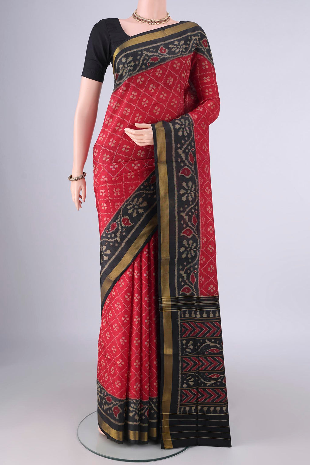 Pure Silk Red Rajkot Patola Saree with Pure Ikat on the body and Ikat Border.  displayed on a mannequin