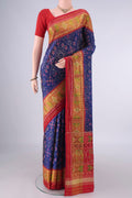 Pure Silk Dark Blue Rajkot Patola Saree with Pure Ikat on the body and Ikat Border.  displayed on a mannequin
