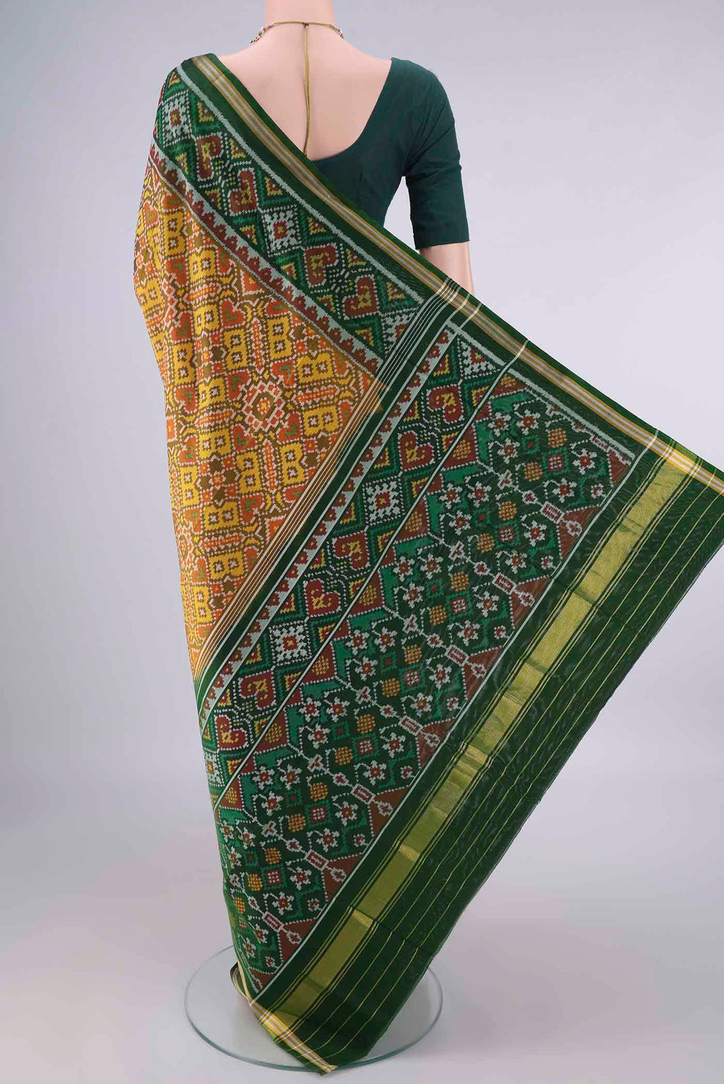 Flat view of Pure Silk Mustard Rajkot Patola Saree with Pure Ikat on the body and Ikat Border. 