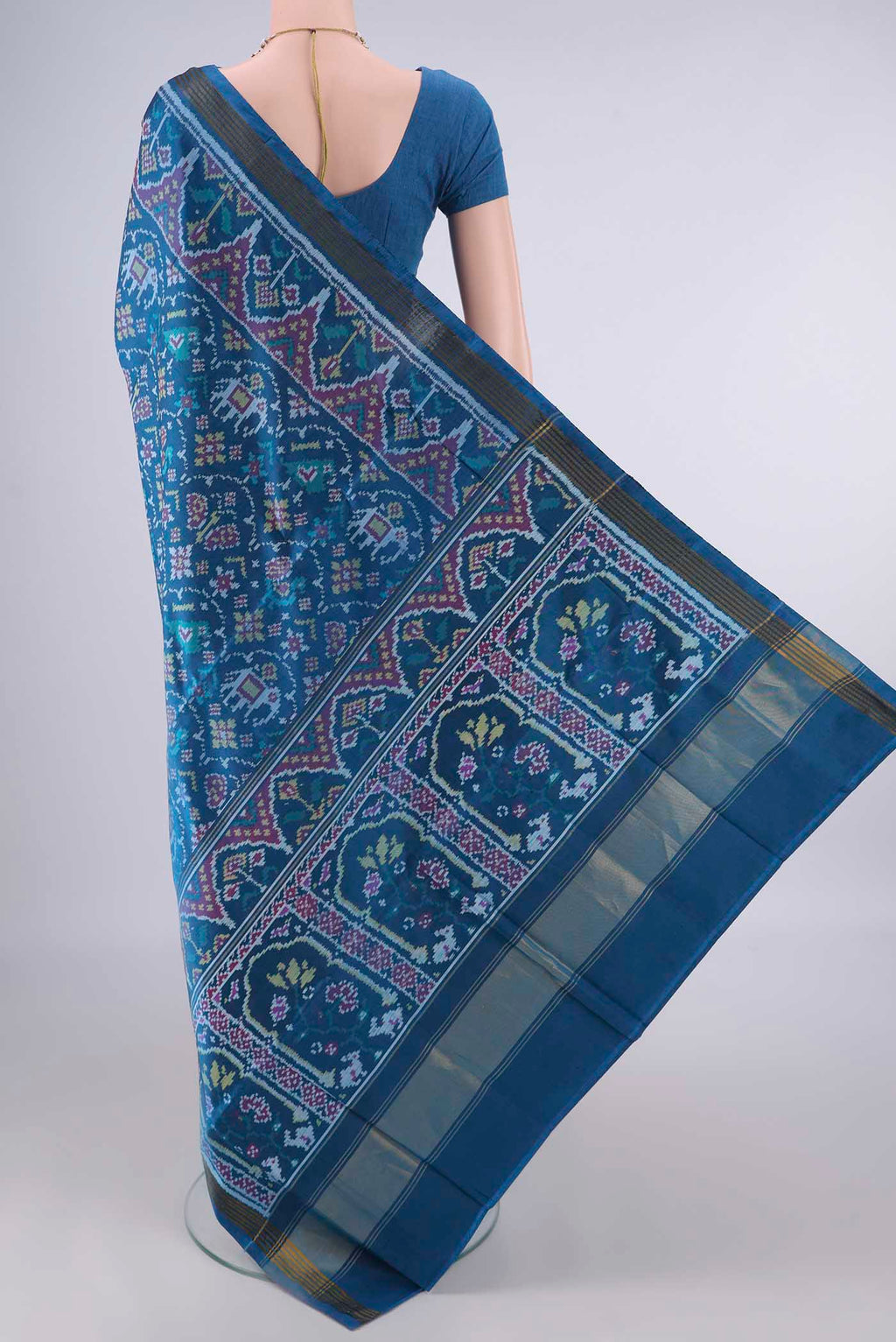 Flat view of Pure Silk Blue Rajkot Patola Saree with Pure Ikat on the body and Ikat Border. 