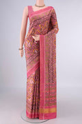 Pure Silk Rose pink Rajkot Patola Saree with Pure Ikat on the body and Ikat Border.  displayed on a mannequin