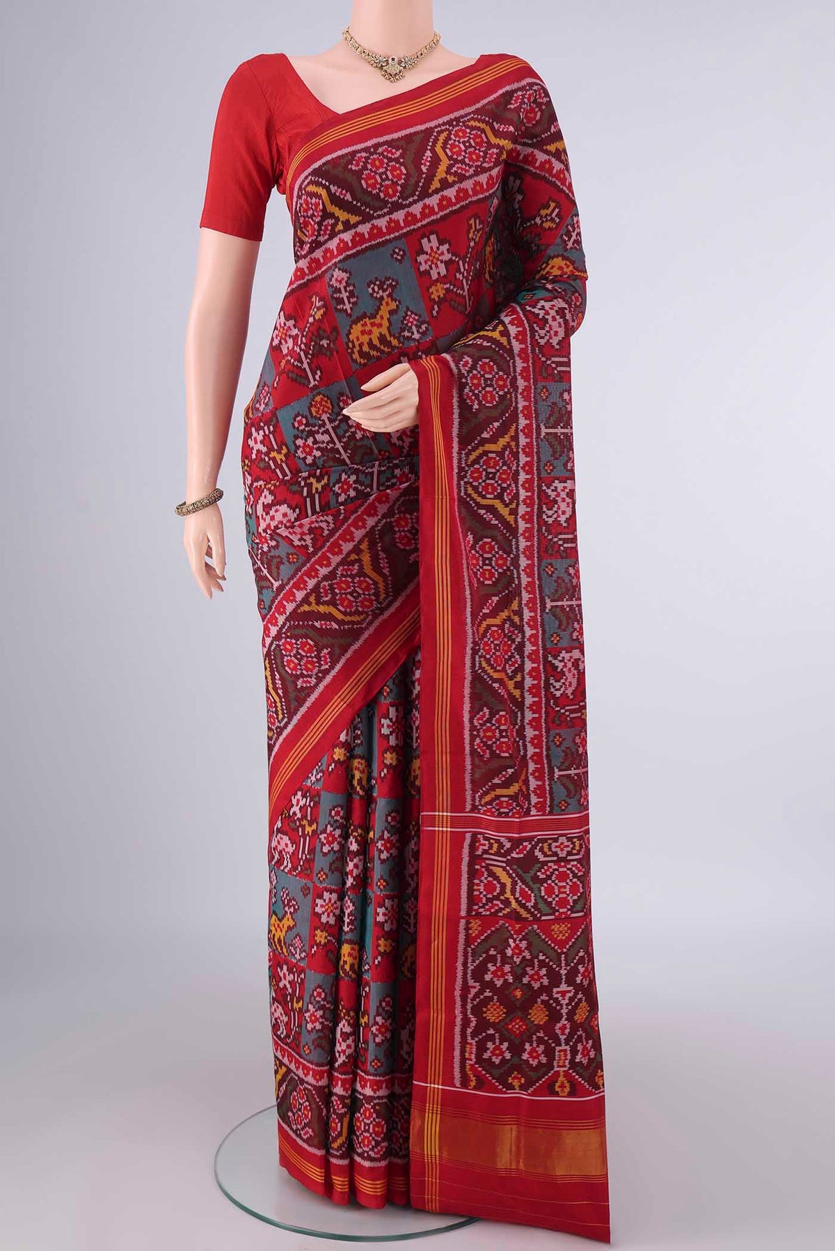 Pure Silk Multi Color Rajkot Patola Saree with Pure Ikat on the body and Ikat Border.  displayed on a mannequin