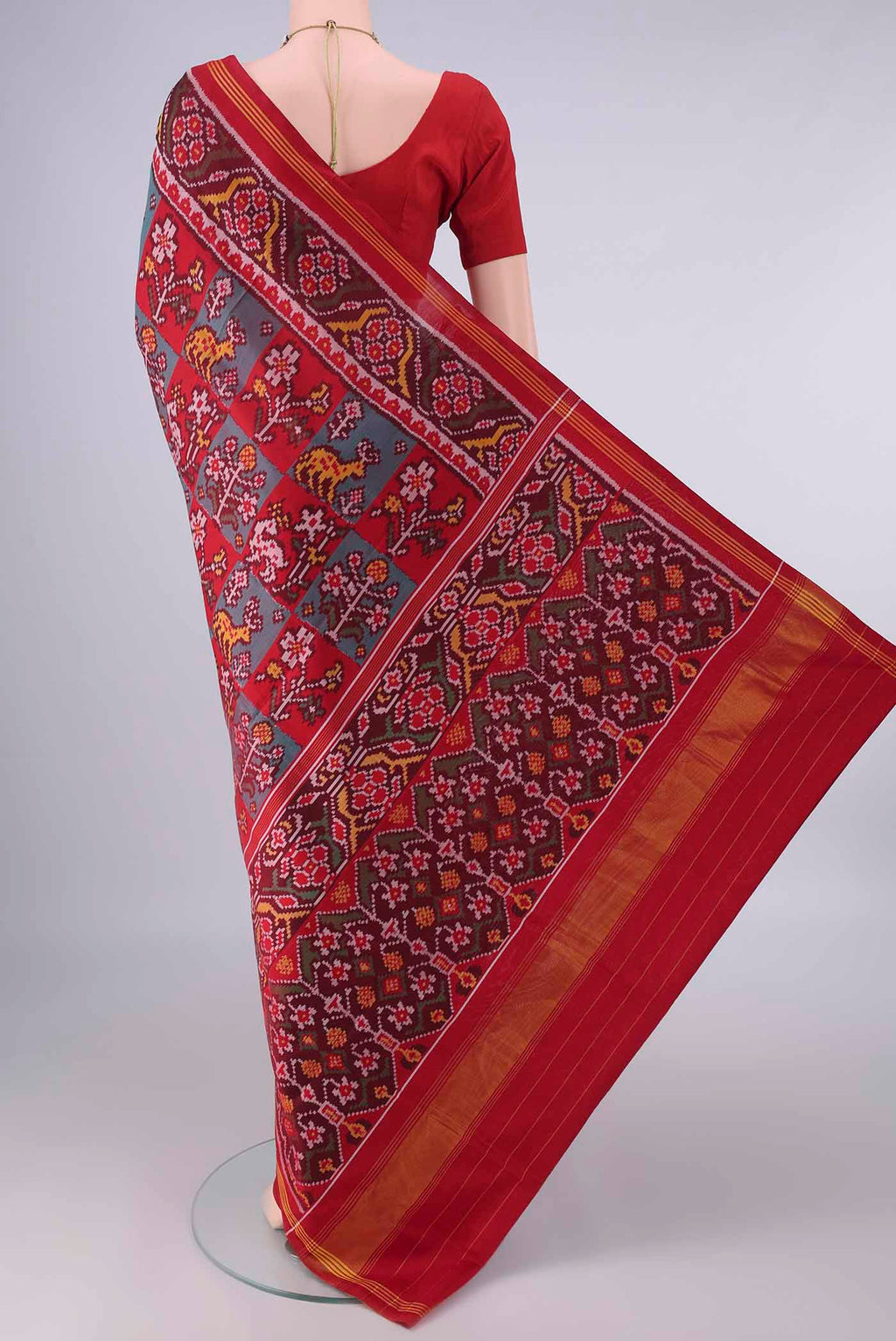 Flat view of Pure Silk Multi Color Rajkot Patola Saree with Pure Ikat on the body and Ikat Border. 