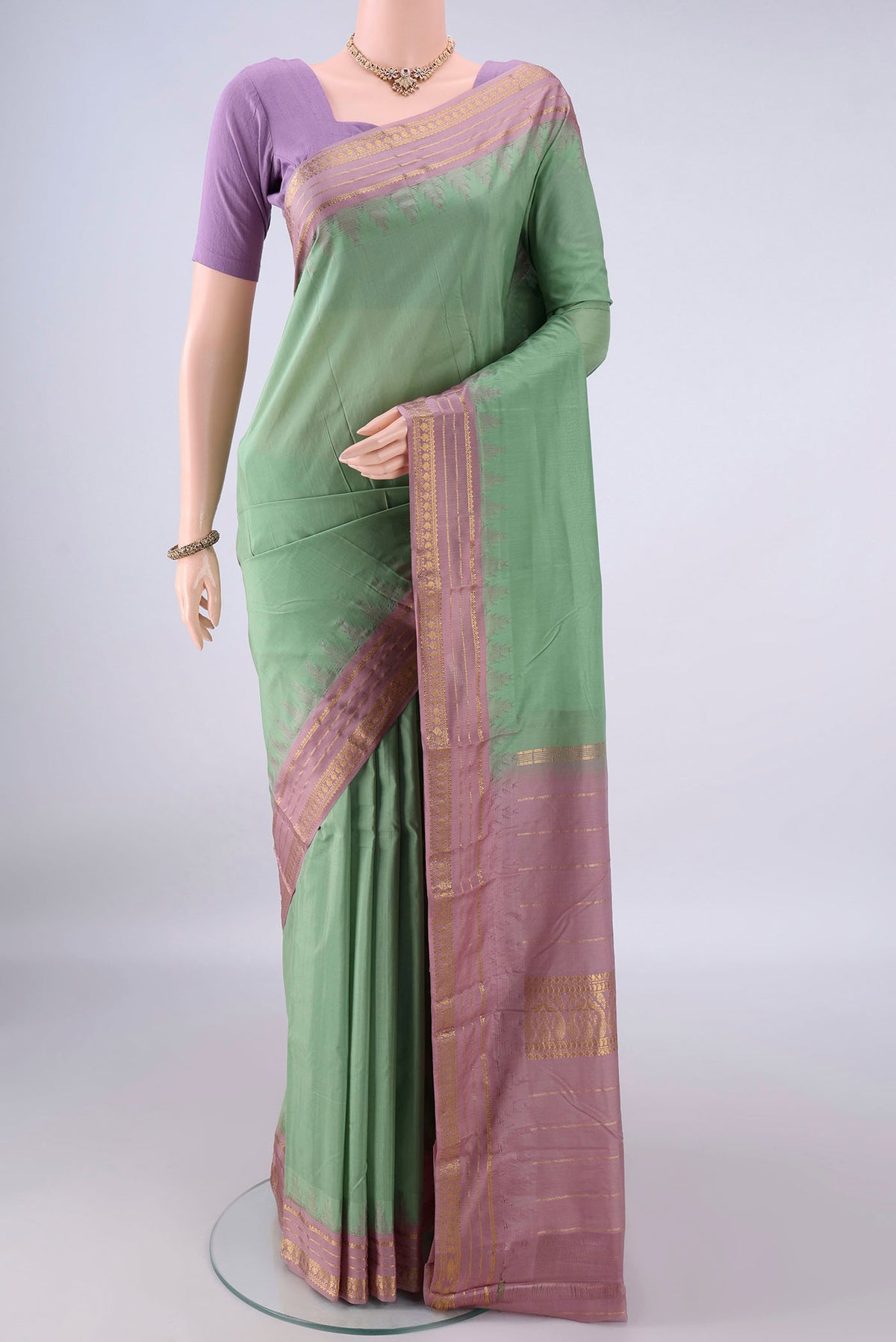 Pure Silk Light Green Bangalore - kadyal Saree with Plain Body and Zari Border.  displayed on a mannequin