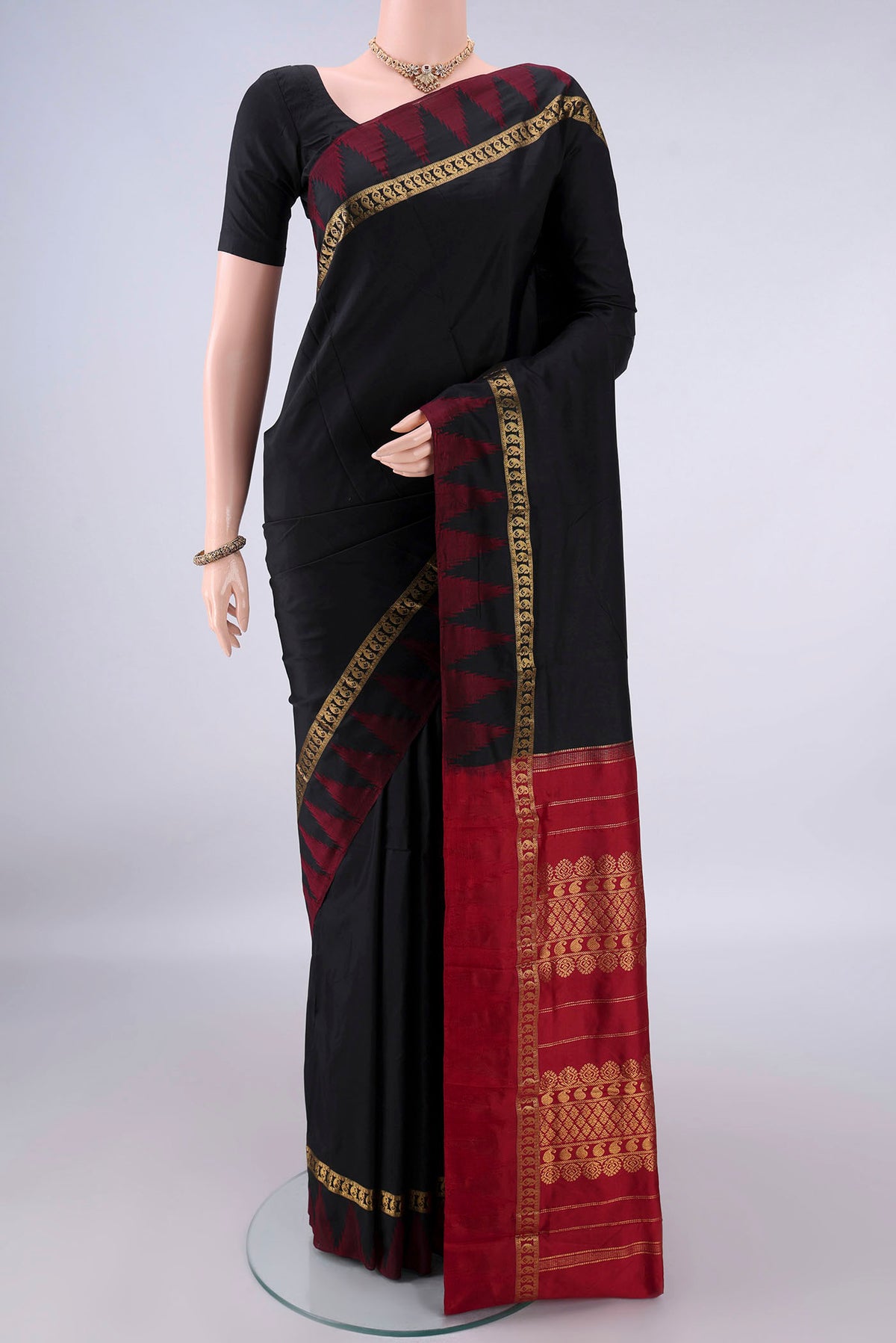 Pure Silk Black Bangalore - kadyal Saree with Plain Body and Temple Border.  displayed on a mannequin