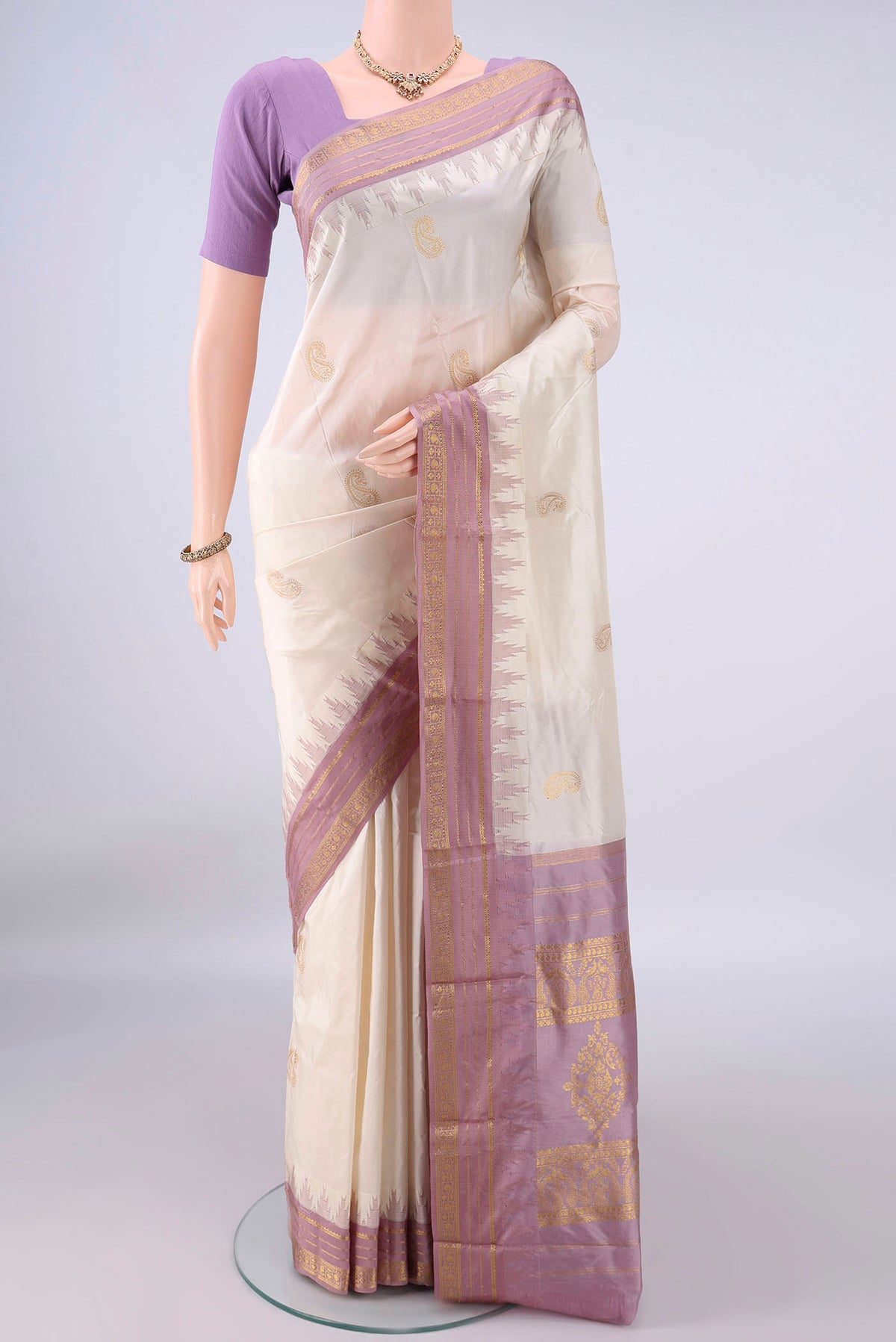 Pure Silk White Bangalore - kadyal Saree with Zari Butta on the body and Zari Border.  displayed on a mannequin