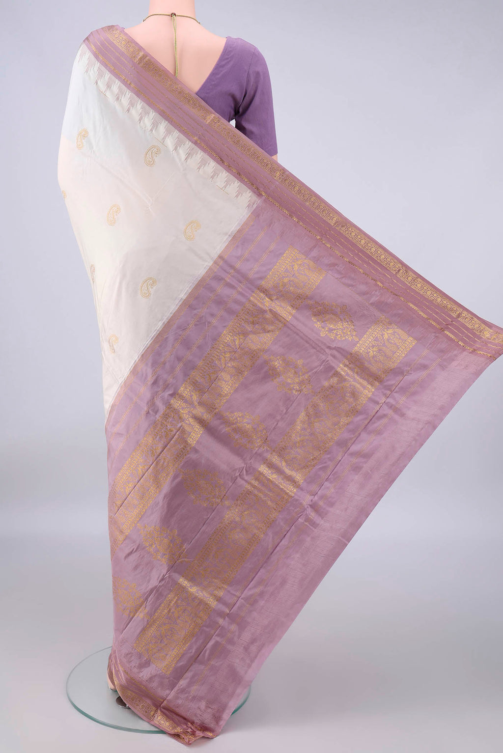 Flat view of Pure Silk White Bangalore - kadyal Saree with Zari Butta on the body and Zari Border. 