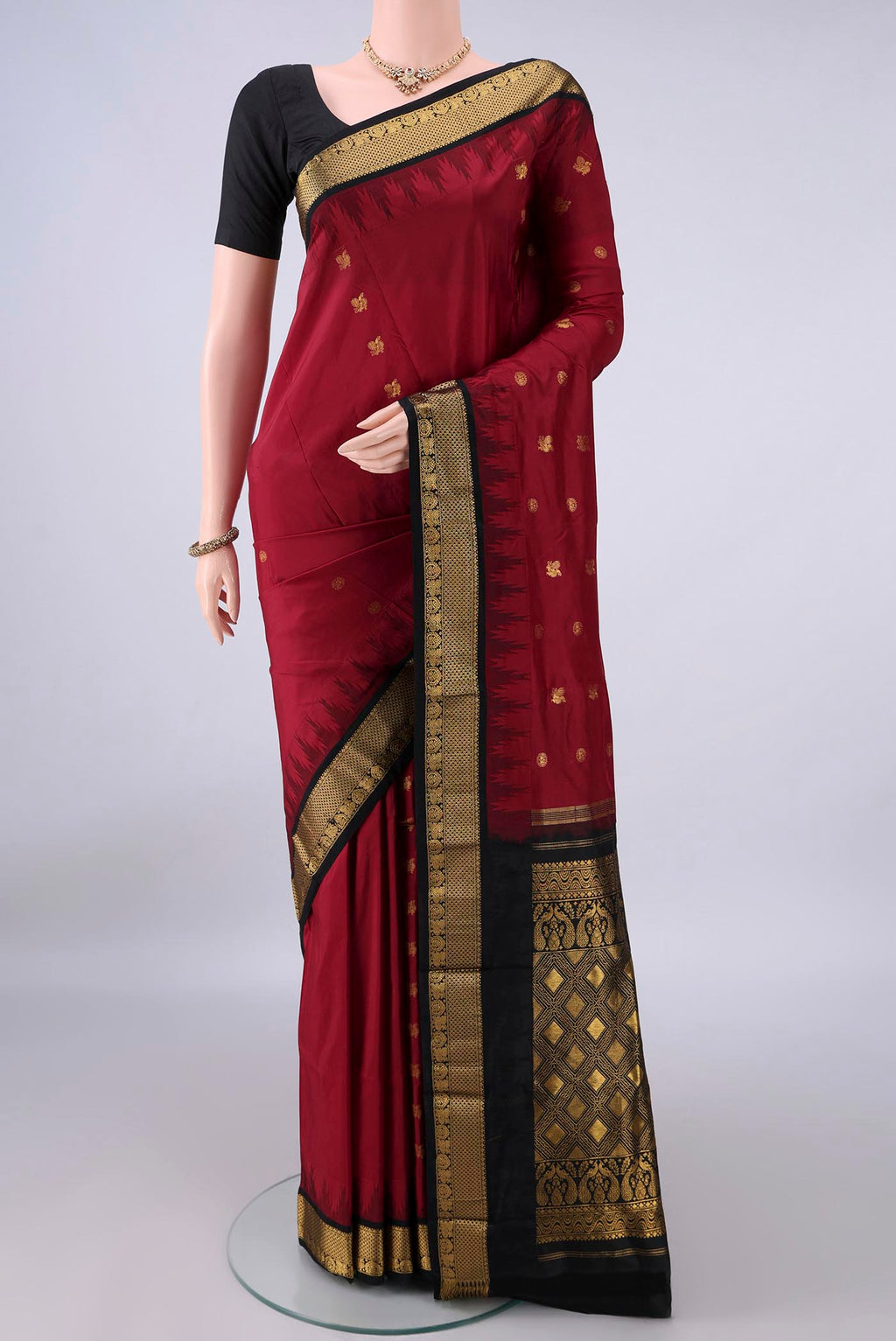 Pure Silk Red Bangalore - kadyal Saree with Plain Body and Zari Border.  displayed on a mannequin
