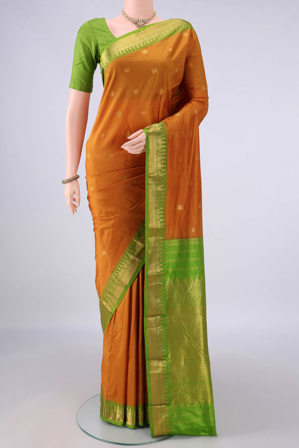 Pure Silk Mustard Bangalore - kadyal Saree with Zari Butta on the body and Zari Border.  displayed on a mannequin