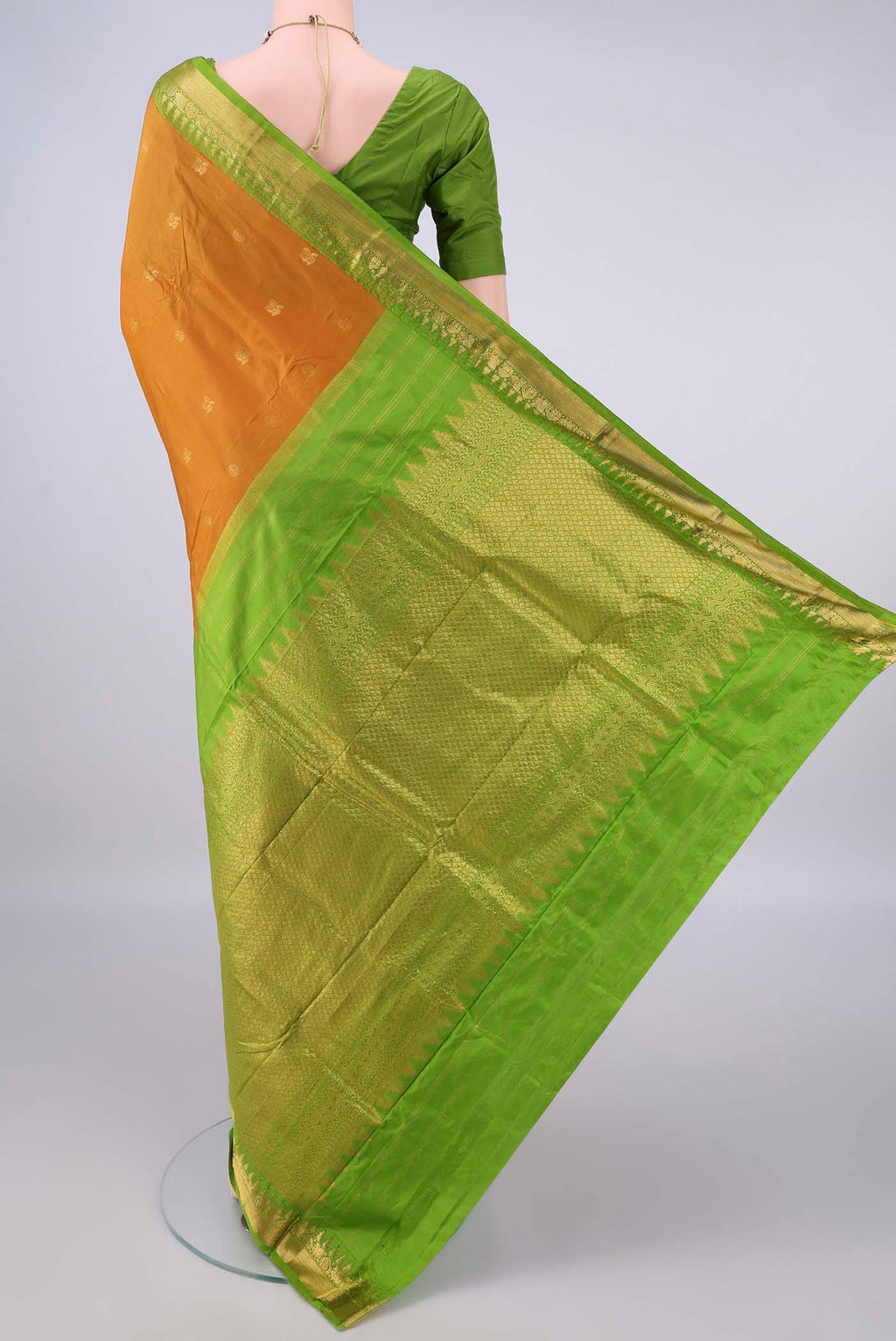 Flat view of Pure Silk Mustard Bangalore - kadyal Saree with Zari Butta on the body and Zari Border. 