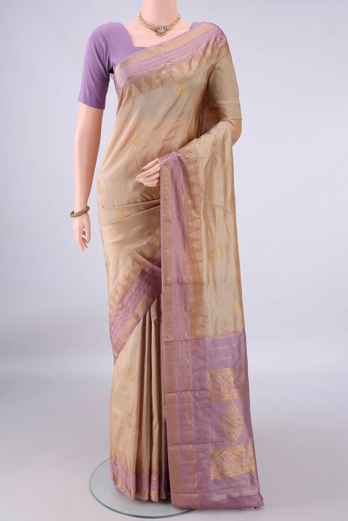 Pure Silk Beige Bangalore - kadyal Saree with Zari Butta on the body and Zari Border.  displayed on a mannequin