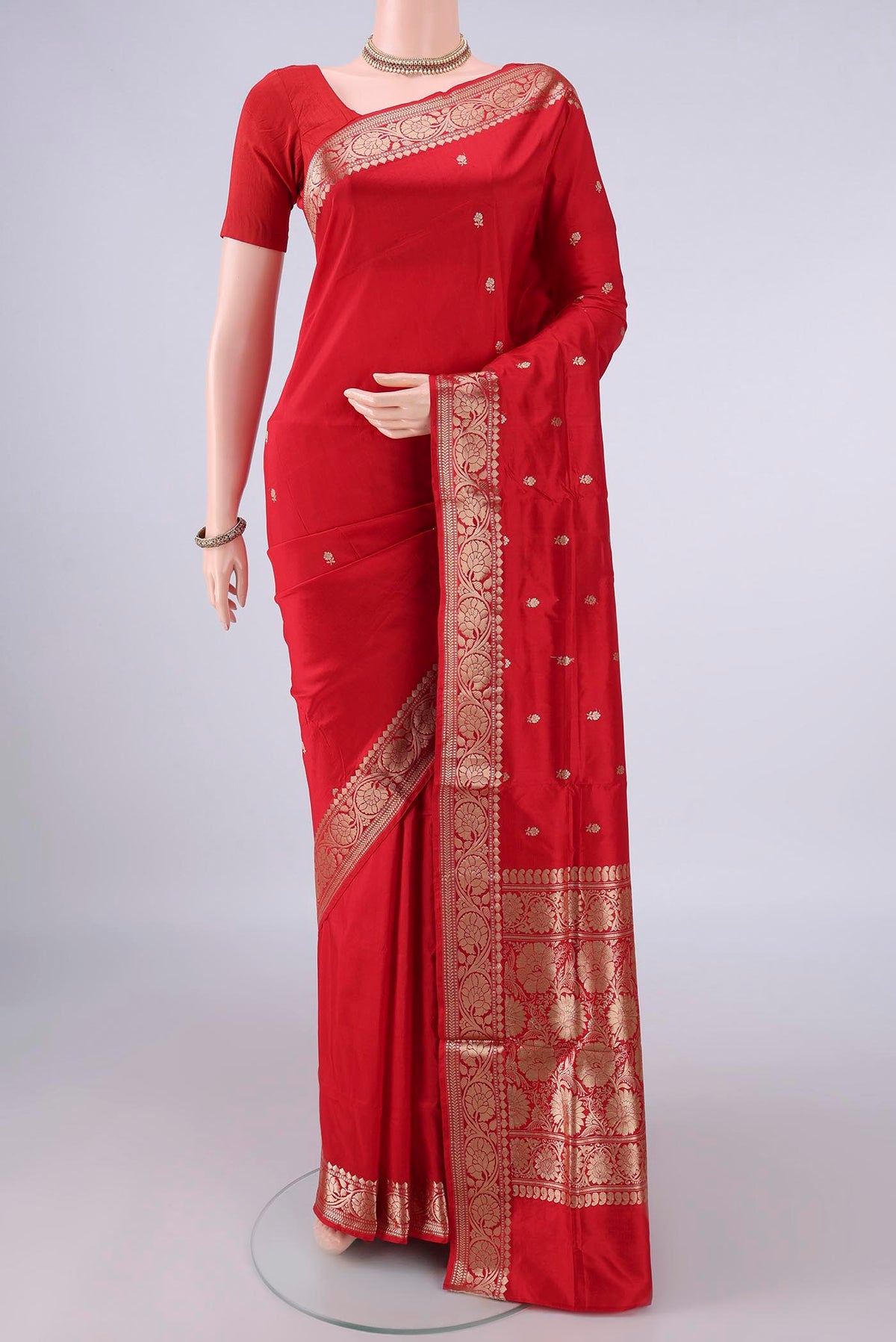 Pure Silk Red Banarasi Katan Saree with Zari Butta on the body and Zari Border.  displayed on a mannequin