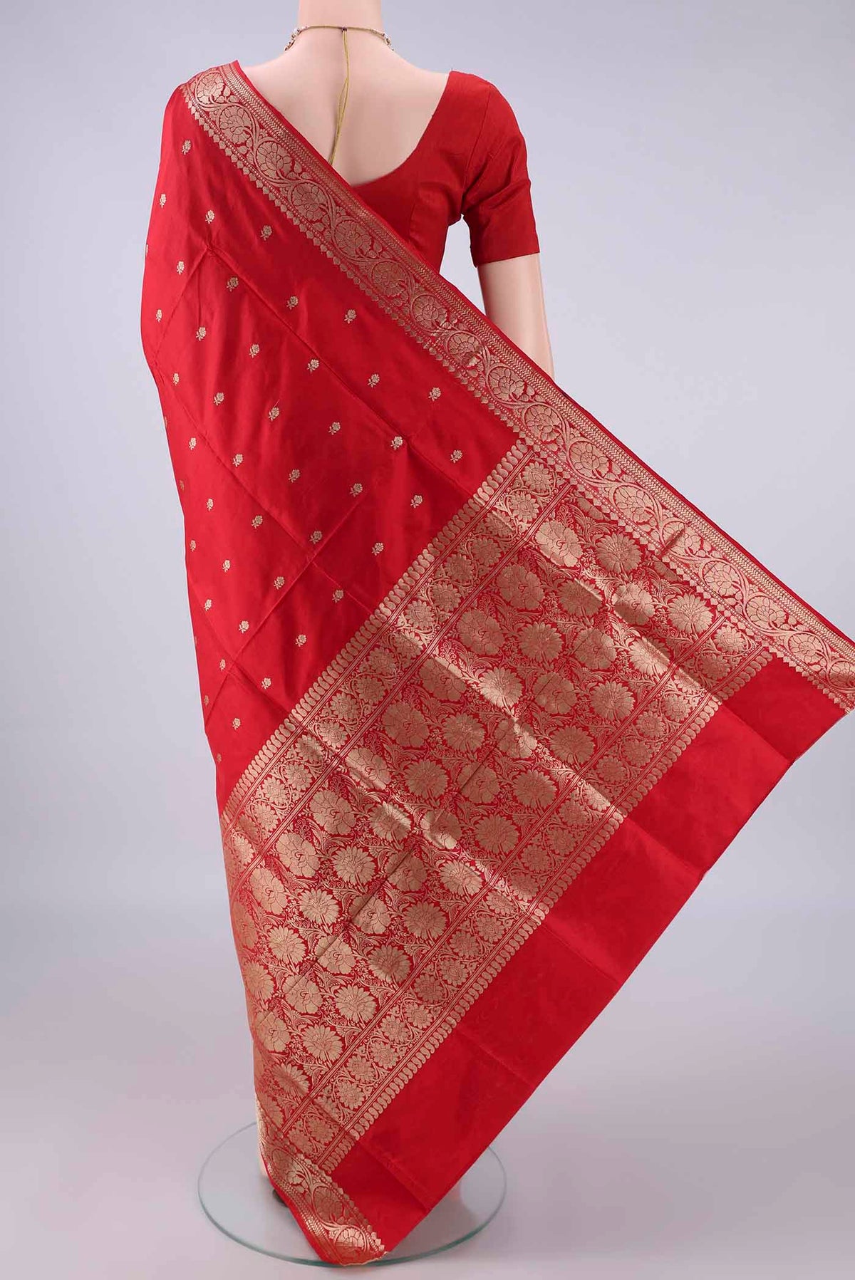 Flat view of Pure Silk Red Banarasi Katan Saree with Zari Butta on the body and Zari Border. 