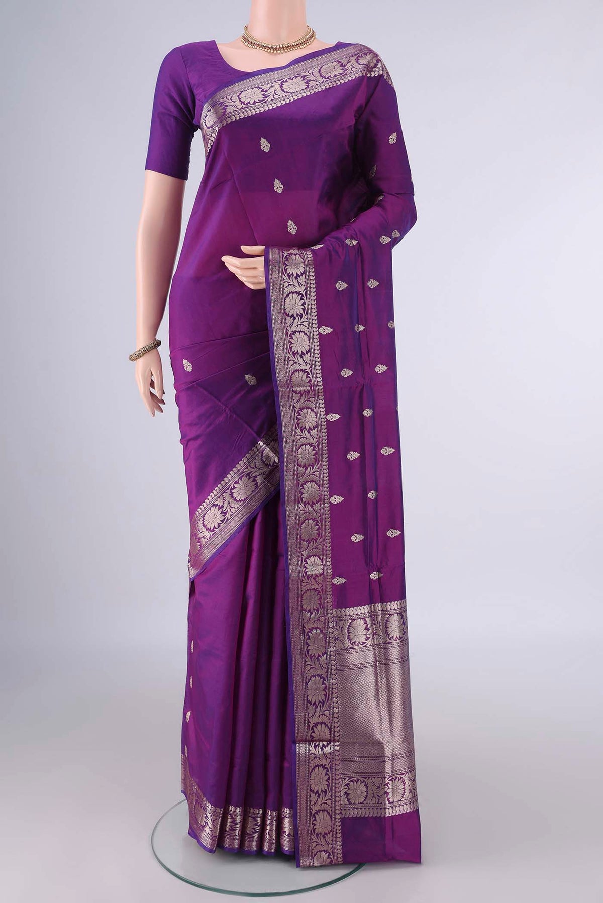 Pure Silk Purple Banarasi Katan Saree with Zari Butta on the body and Zari Border.  displayed on a mannequin