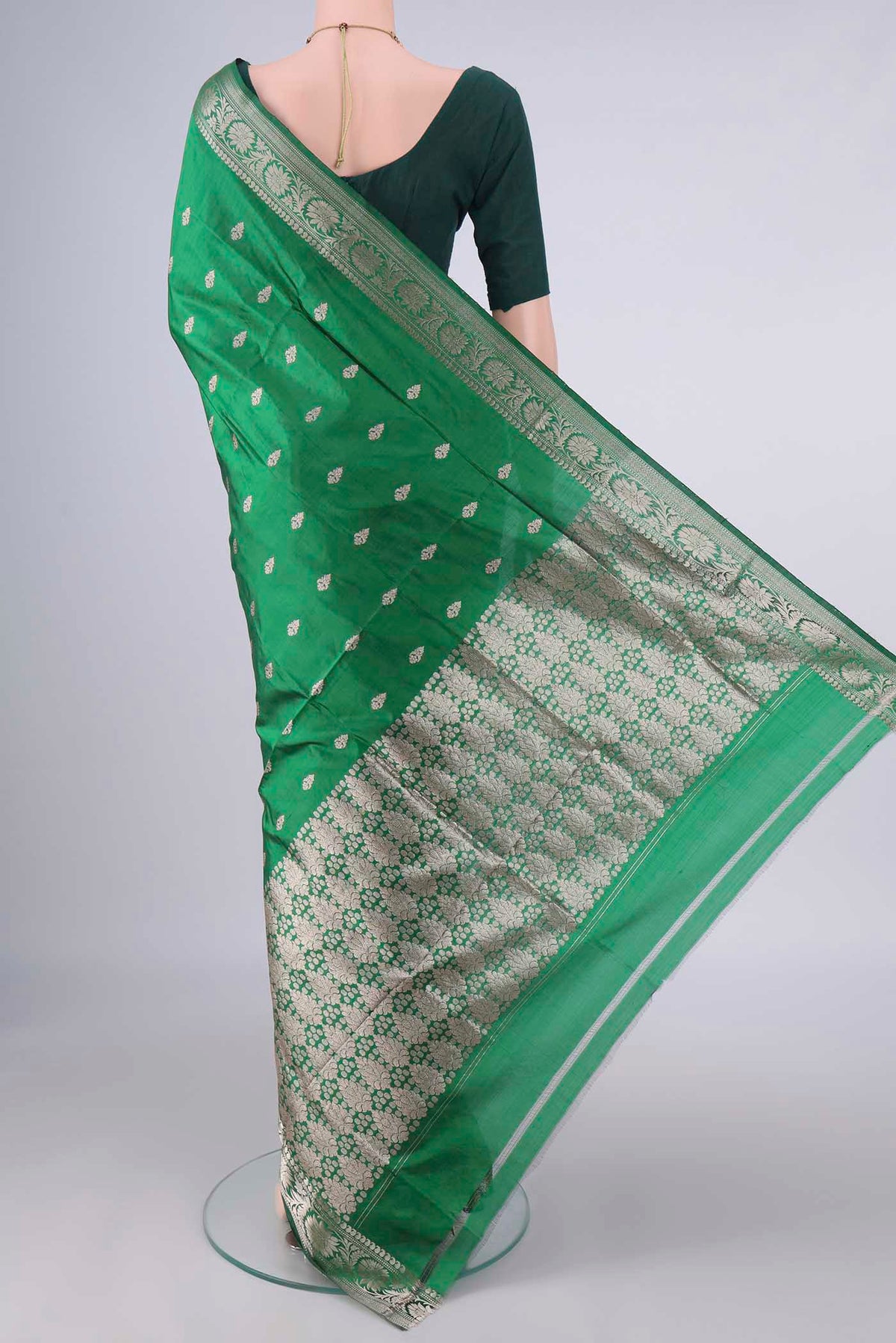 Flat view of Pure Silk Green Banarasi Katan Saree with Zari Butta on the body and Zari Border. 