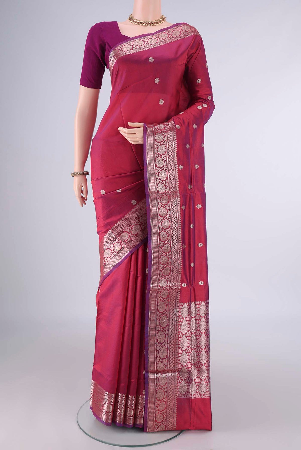Pure Silk Maroon Dual Tone Banarasi Katan Saree with Zari Butta on the body and Zari Border.  displayed on a mannequin