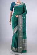 Pure Silk Green Dual Tone Banarasi Katan Saree with Zari Butta on the body and Zari Border.  displayed on a mannequin