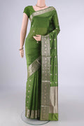 Pure Silk Mehandi Green Banarasi Katan Saree with Zari Butta on the body and Zari Border.  displayed on a mannequin