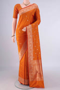 Pure Silk Orange Banarasi Katan Saree with Zari Butta on the body and Zari Border.  displayed on a mannequin