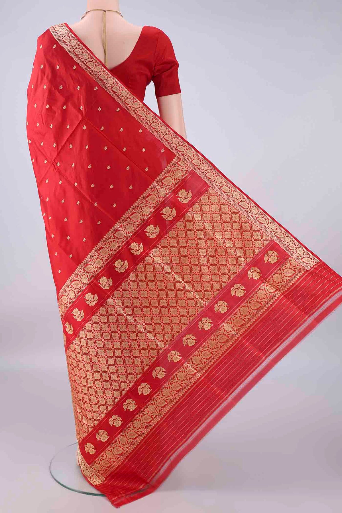 Flat view of Pure Silk Red Banarasi Katan Saree with Thread Butta on the body and Thread Border. 