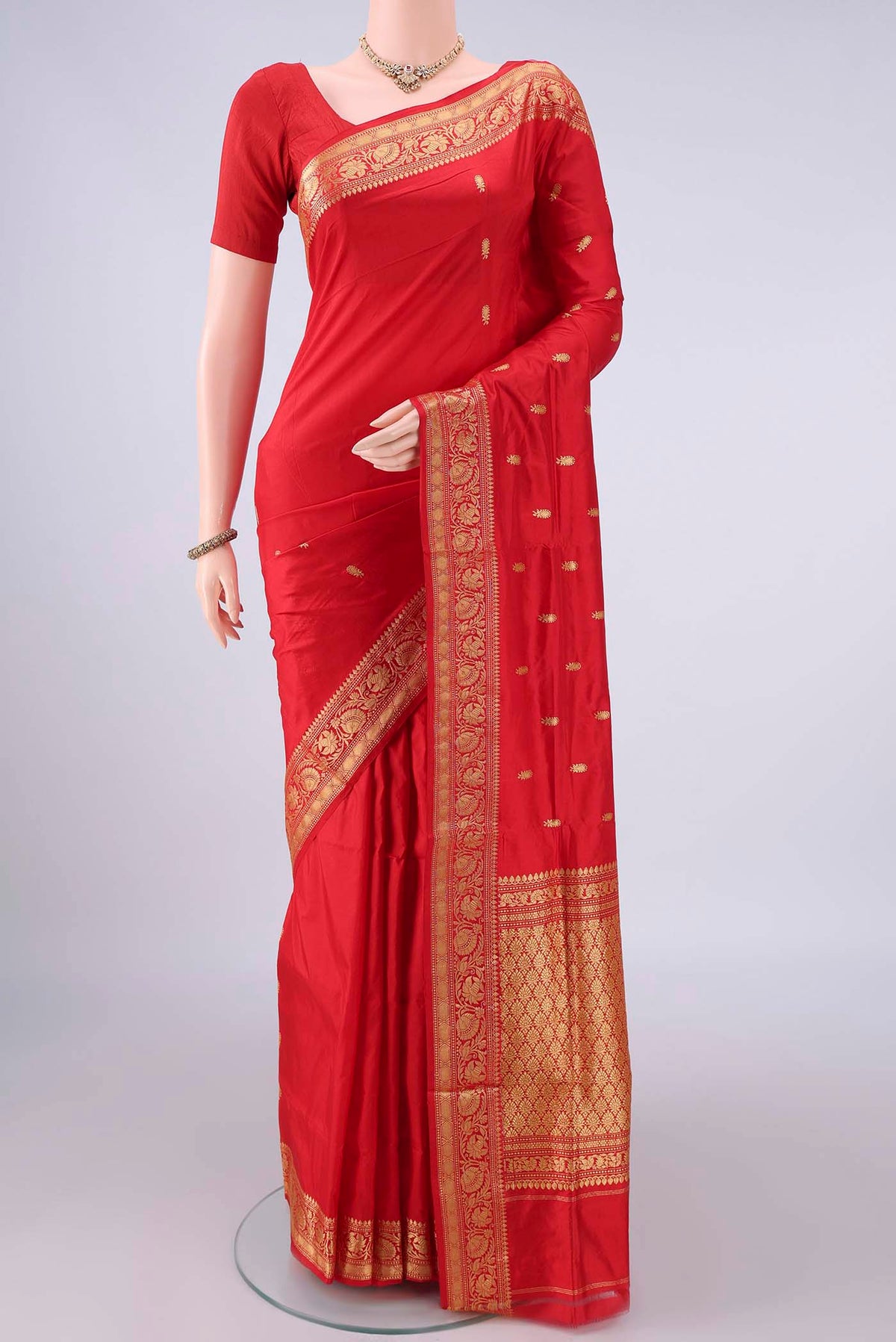 Pure Silk Red Banarasi Katan Saree with Zari Butta on the body and Zari Border.  displayed on a mannequin