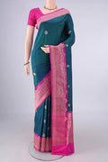 Pure Silk Peacock Blue Banarasi Katan Saree with Zari Butta on the body and Zari Border.  displayed on a mannequin