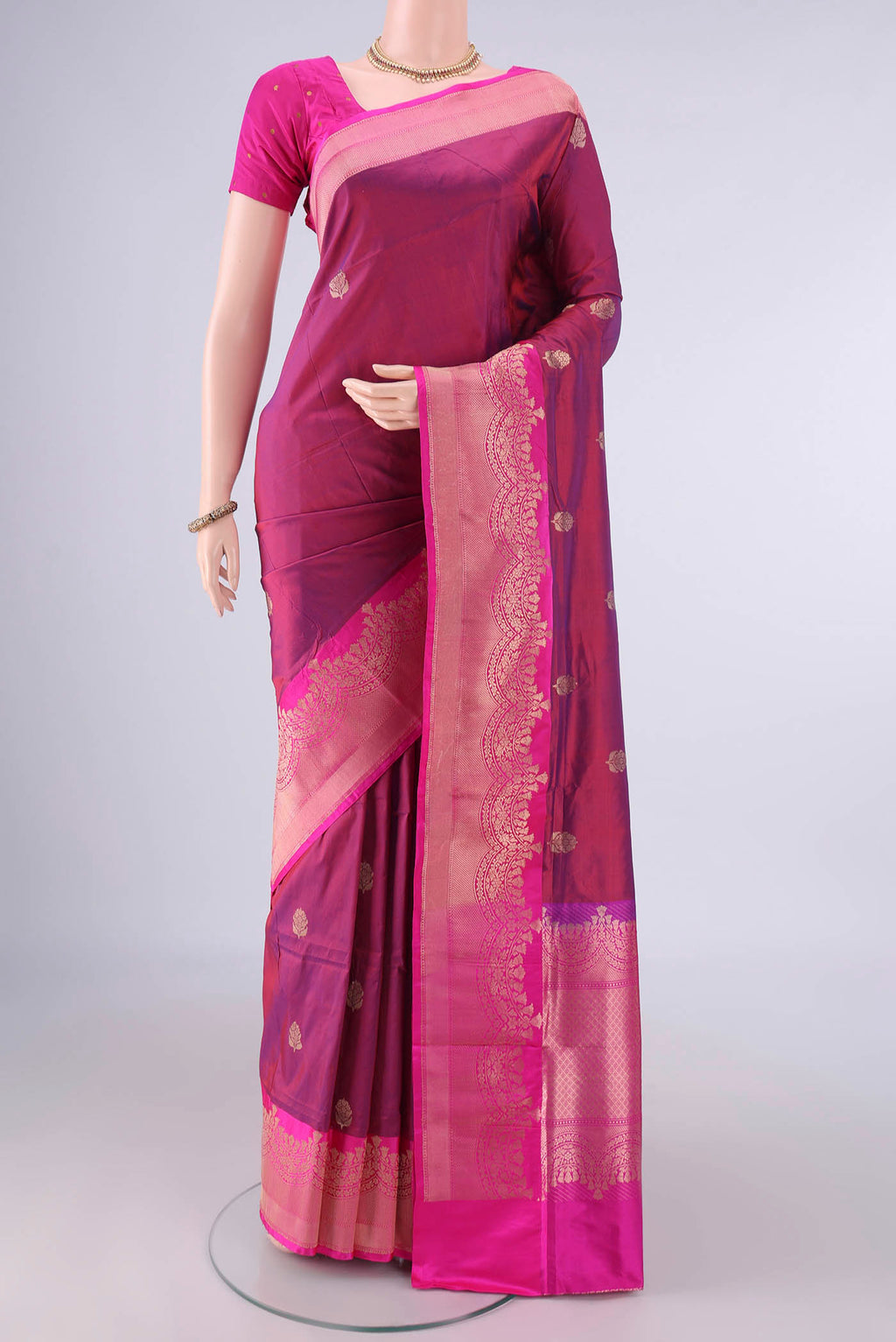 Pure Silk Magenta Dual Tone Banarasi Katan Saree with Zari Butta on the body and Zari Border.  displayed on a mannequin