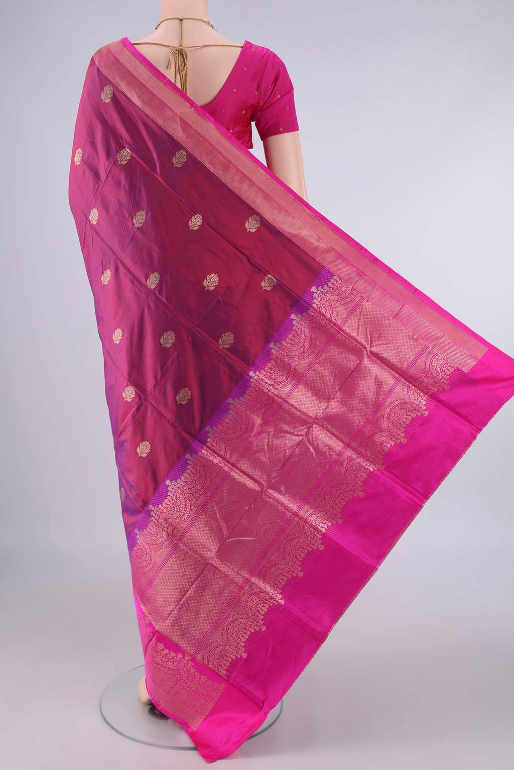 Flat view of Pure Silk Magenta Dual Tone Banarasi Katan Saree with Zari Butta on the body and Zari Border. 