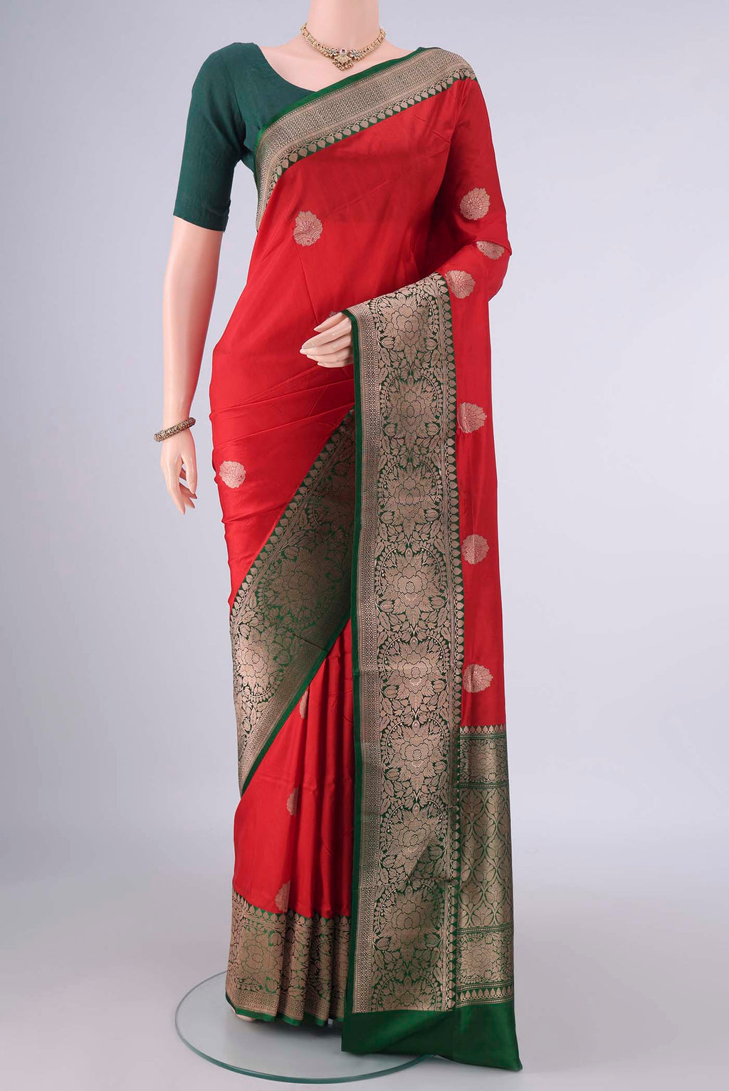 Pure Silk Red Banarasi Katan Saree with Zari Butta on the body and Zari Border.  displayed on a mannequin