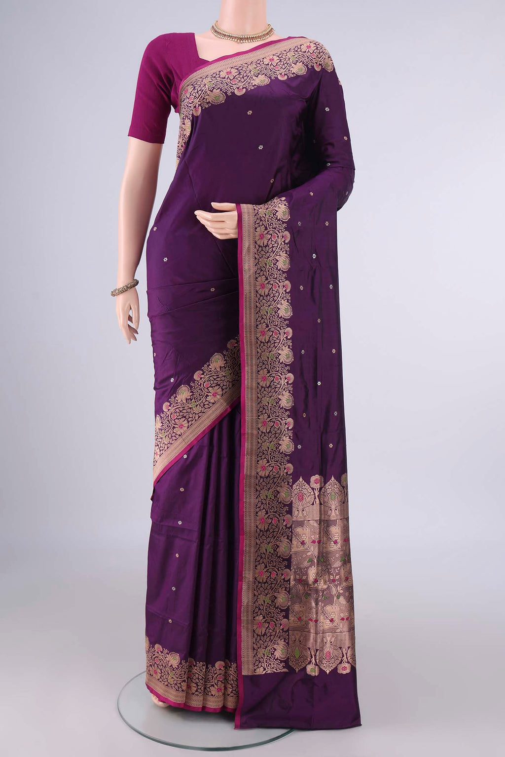 Pure Silk Purple Banarasi Katan Saree with Zari Butta on the body and Zari Border.  displayed on a mannequin