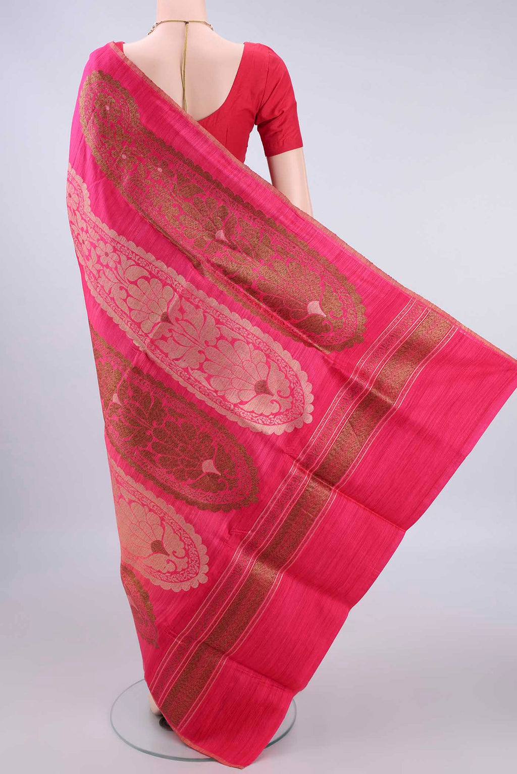 Flat view of Pure Silk Pink and Coral Color Jute Saree with Zari Butta on the body and Zari Border. 