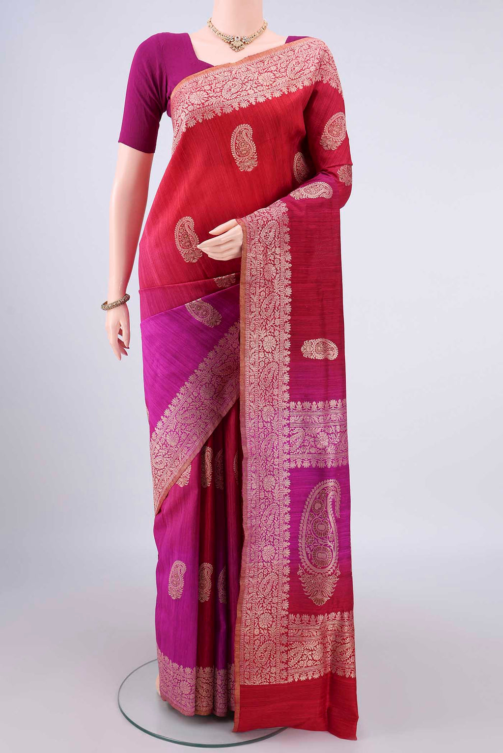 Pure Silk Red and Magenta Color Jute Saree with Zari Butta on the body and Zari Border.  displayed on a mannequin