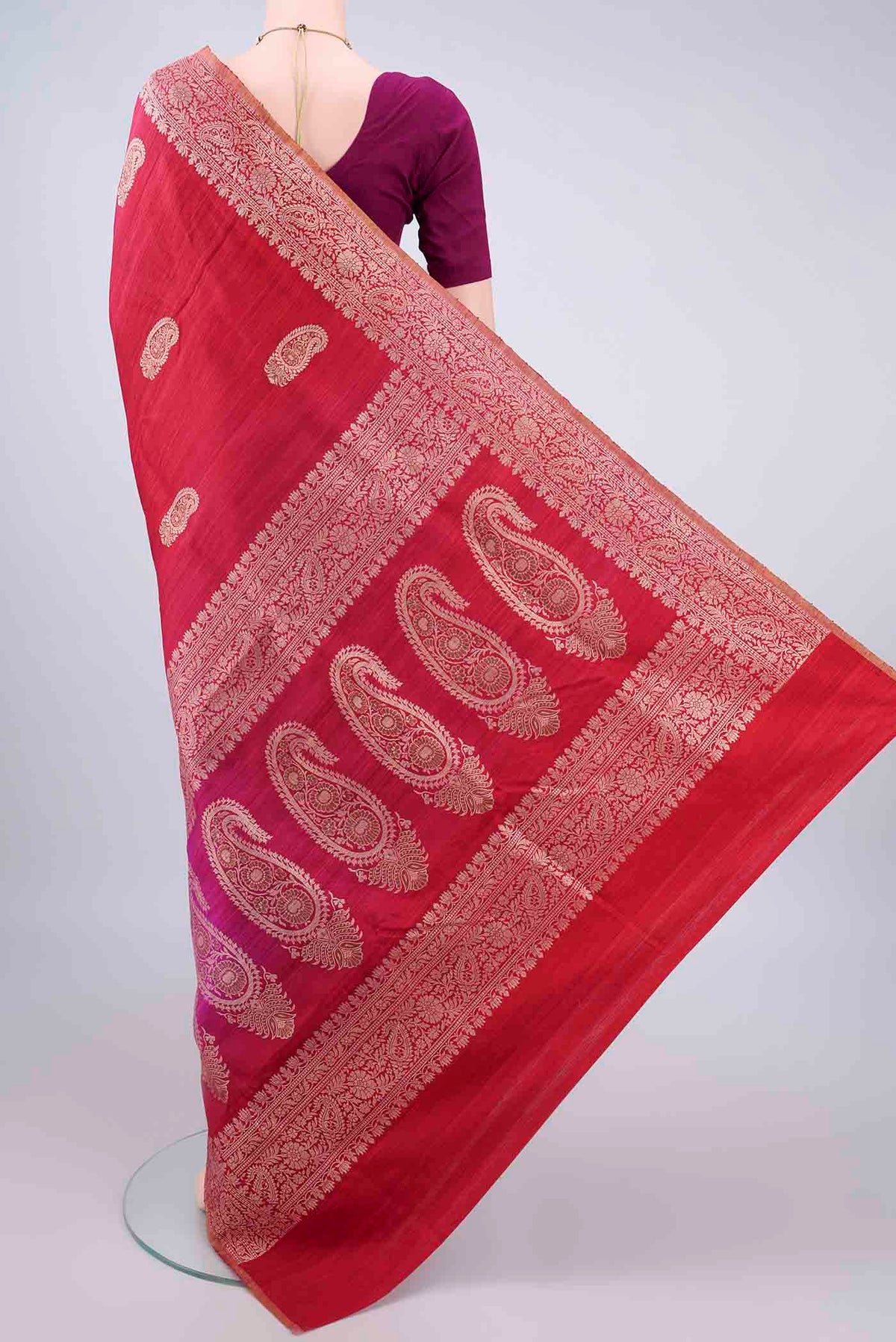 Flat view of Pure Silk Red and Magenta Color Jute Saree with Zari Butta on the body and Zari Border. 