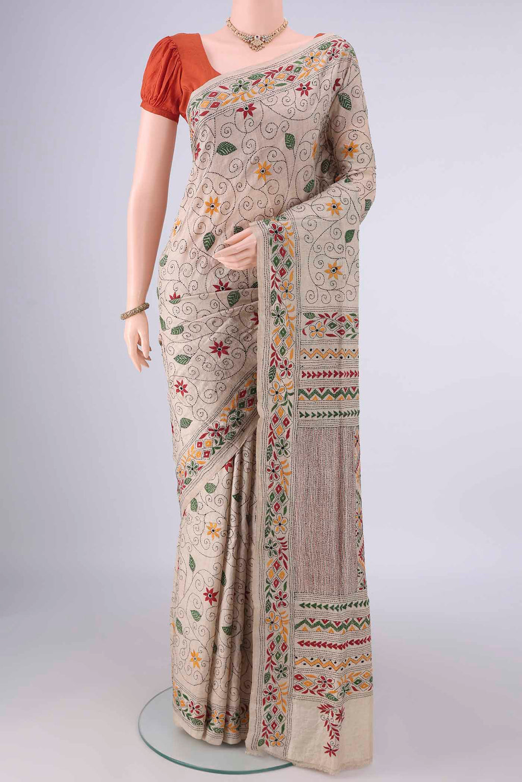 Beige Tussar Saree with Kantha Work on the body and Thread Border.  displayed on a mannequin