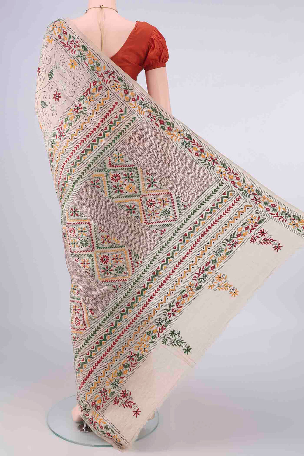 Flat view of Beige Tussar Saree with Kantha Work on the body and Thread Border. 
