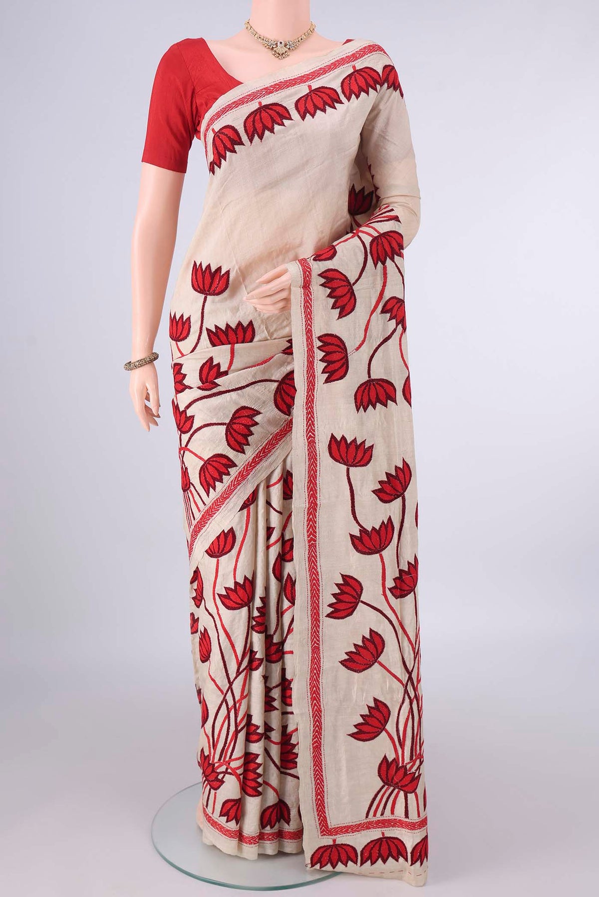 Beige Tussar Saree with Kantha Work on the body and Thread Border.  displayed on a mannequin