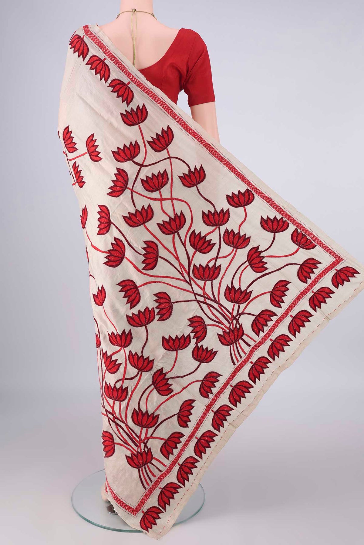Flat view of Beige Tussar Saree with Kantha Work on the body and Thread Border. 