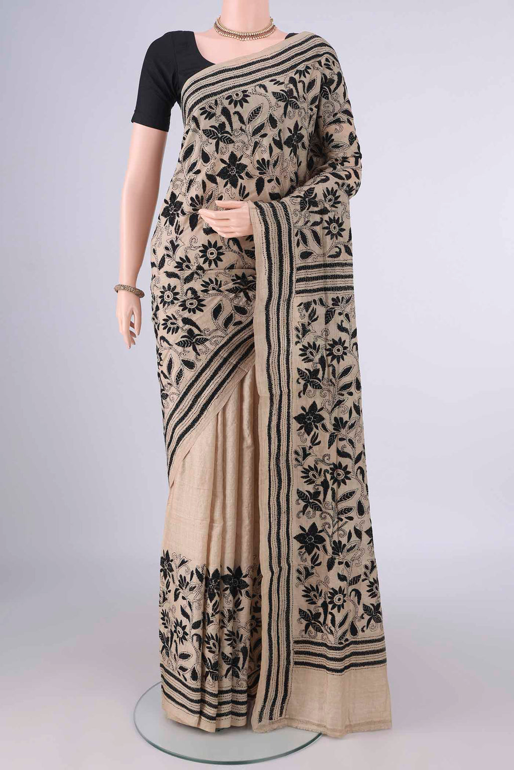 Beige Tussar Saree with Kantha Work on the body and Thread Border.  displayed on a mannequin