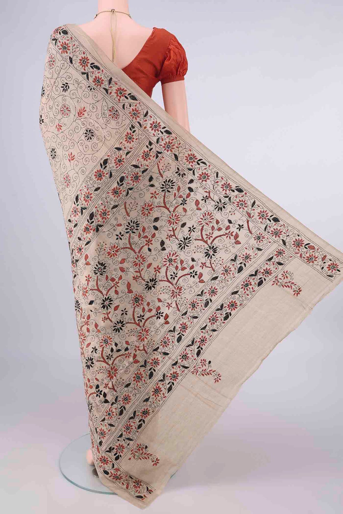 Flat view of Dark Beige Tussar Saree with Kantha Work on the body and Thread Border. 