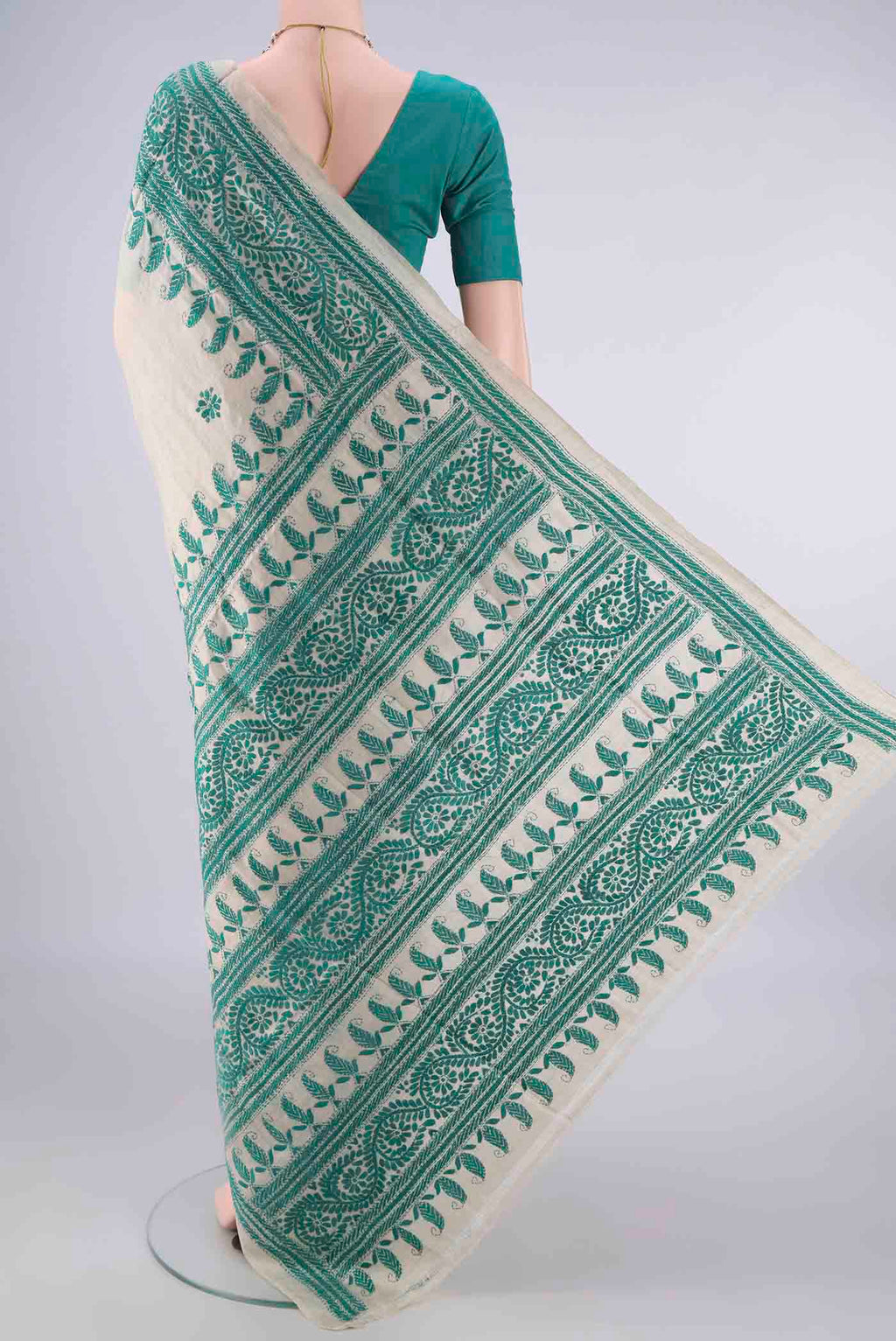 Flat view of Beige Tussar Saree with Kantha Work on the body and Thread Border. 