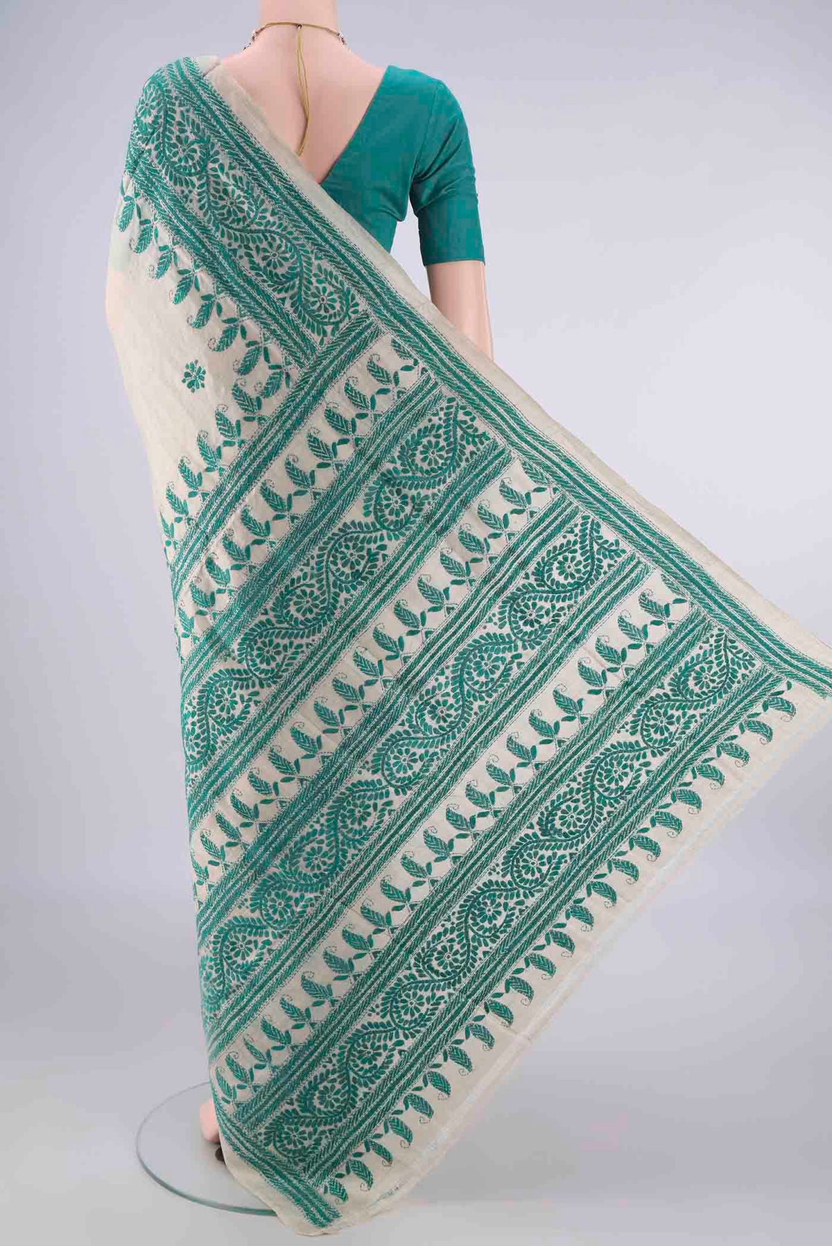 Flat view of Beige Tussar Saree with Kantha Work on the body and Thread Border. 
