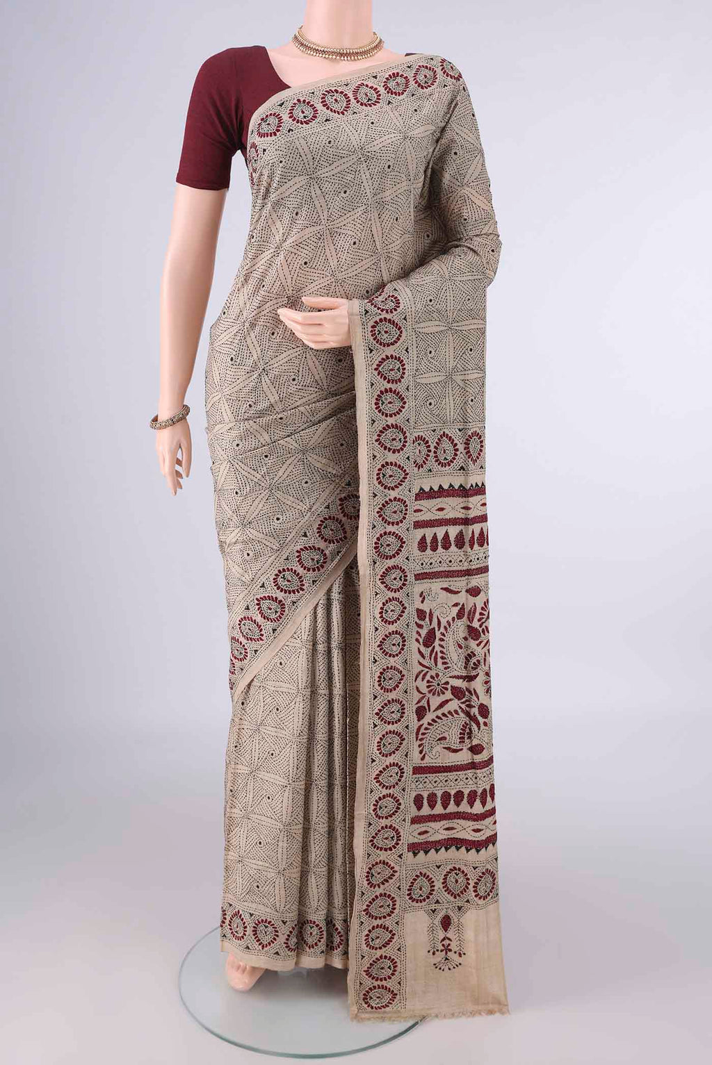 Beige Tussar Saree with Kantha Work on the body and Thread Border.  displayed on a mannequin