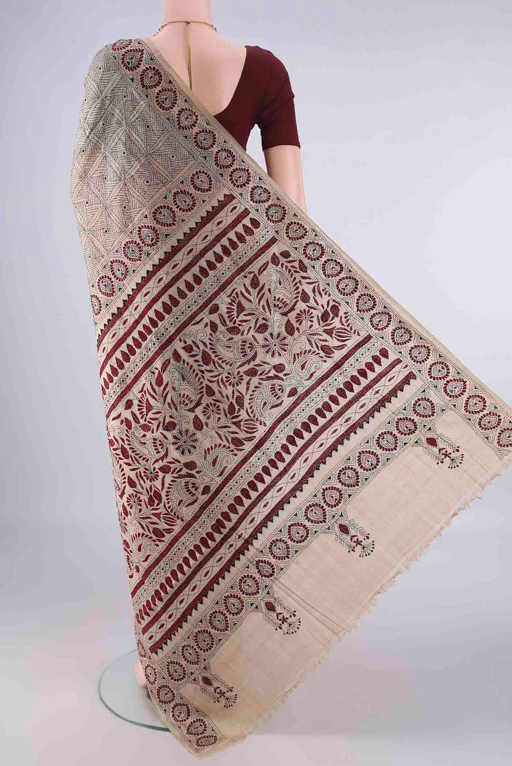 Flat view of Beige Tussar Saree with Kantha Work on the body and Thread Border. 