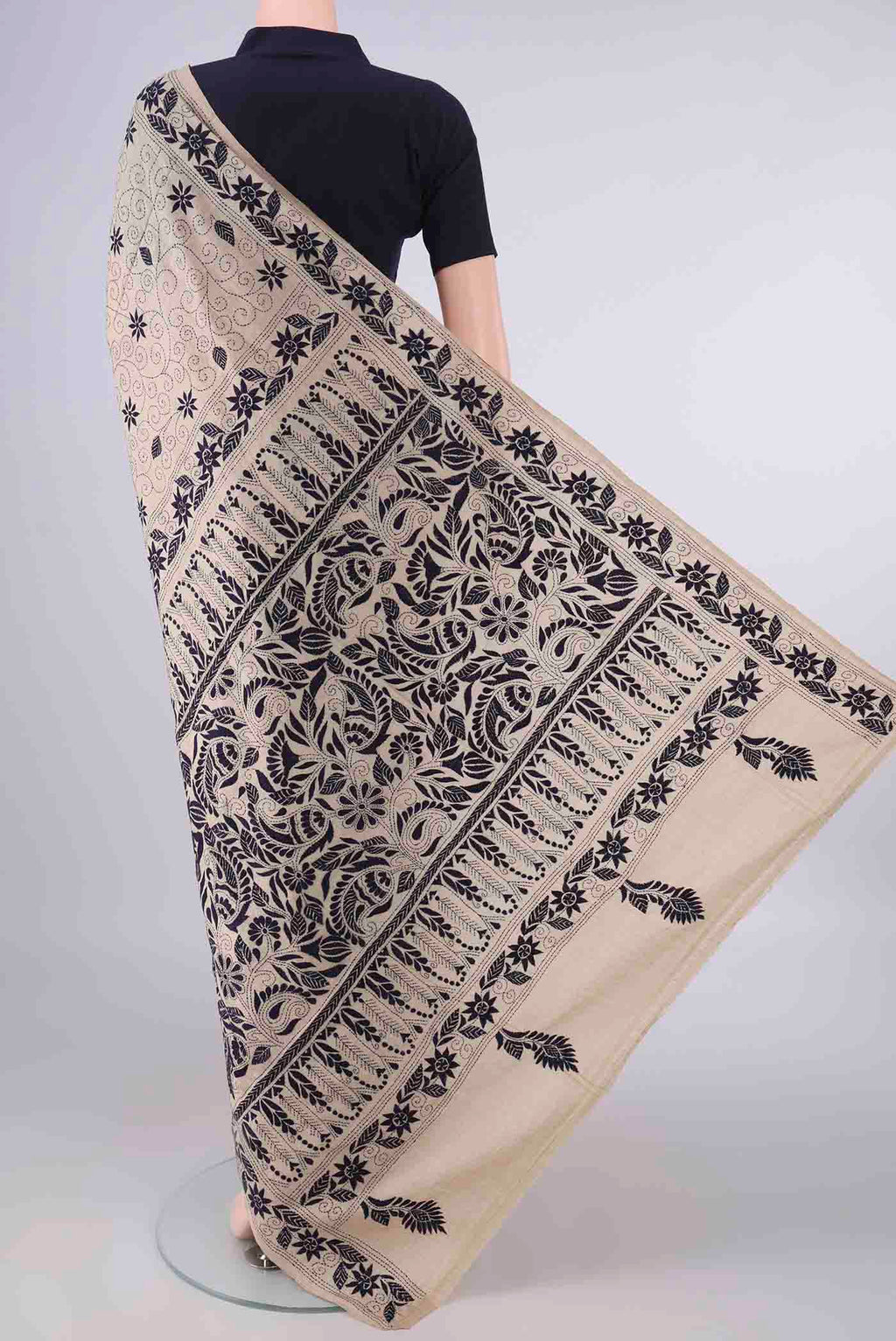 Flat view of Beige Tussar Saree with Kantha Work on the body and Thread Border. 