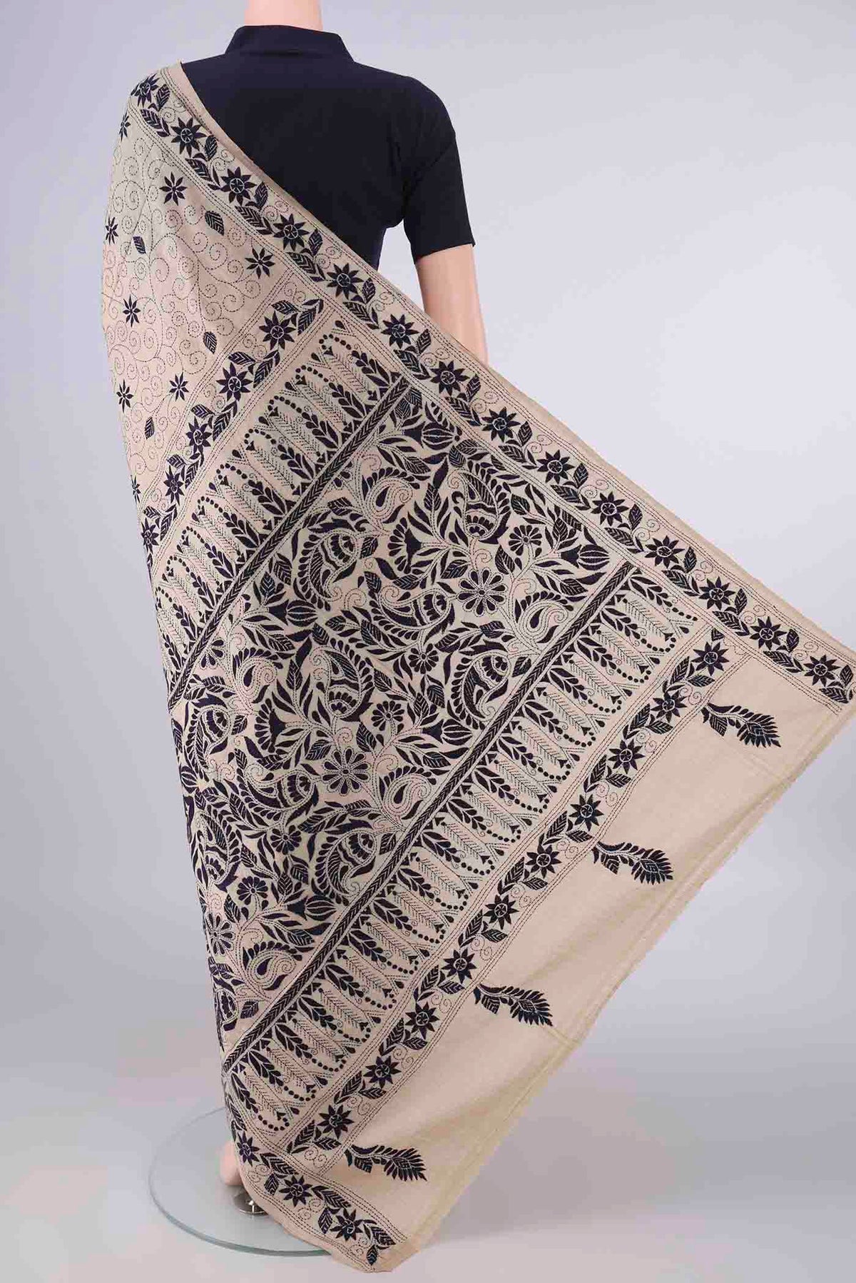 Flat view of Beige Tussar Saree with Kantha Work on the body and Thread Border. 