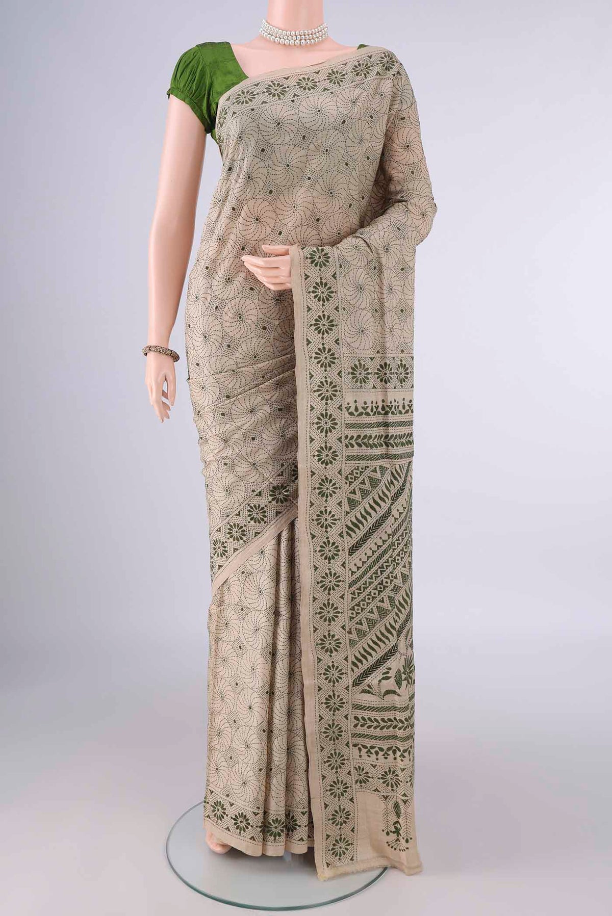 Beige Tussar Saree with Kantha Work on the body and Thread Border.  displayed on a mannequin