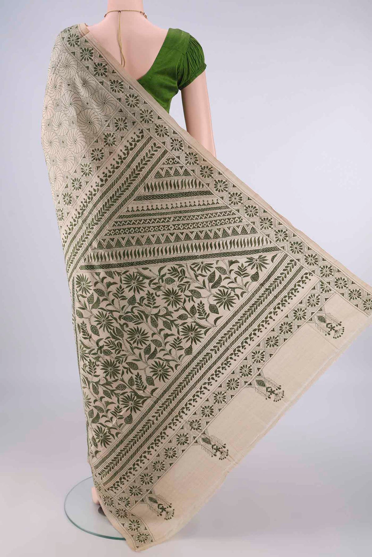 Flat view of Beige Tussar Saree with Kantha Work on the body and Thread Border. 