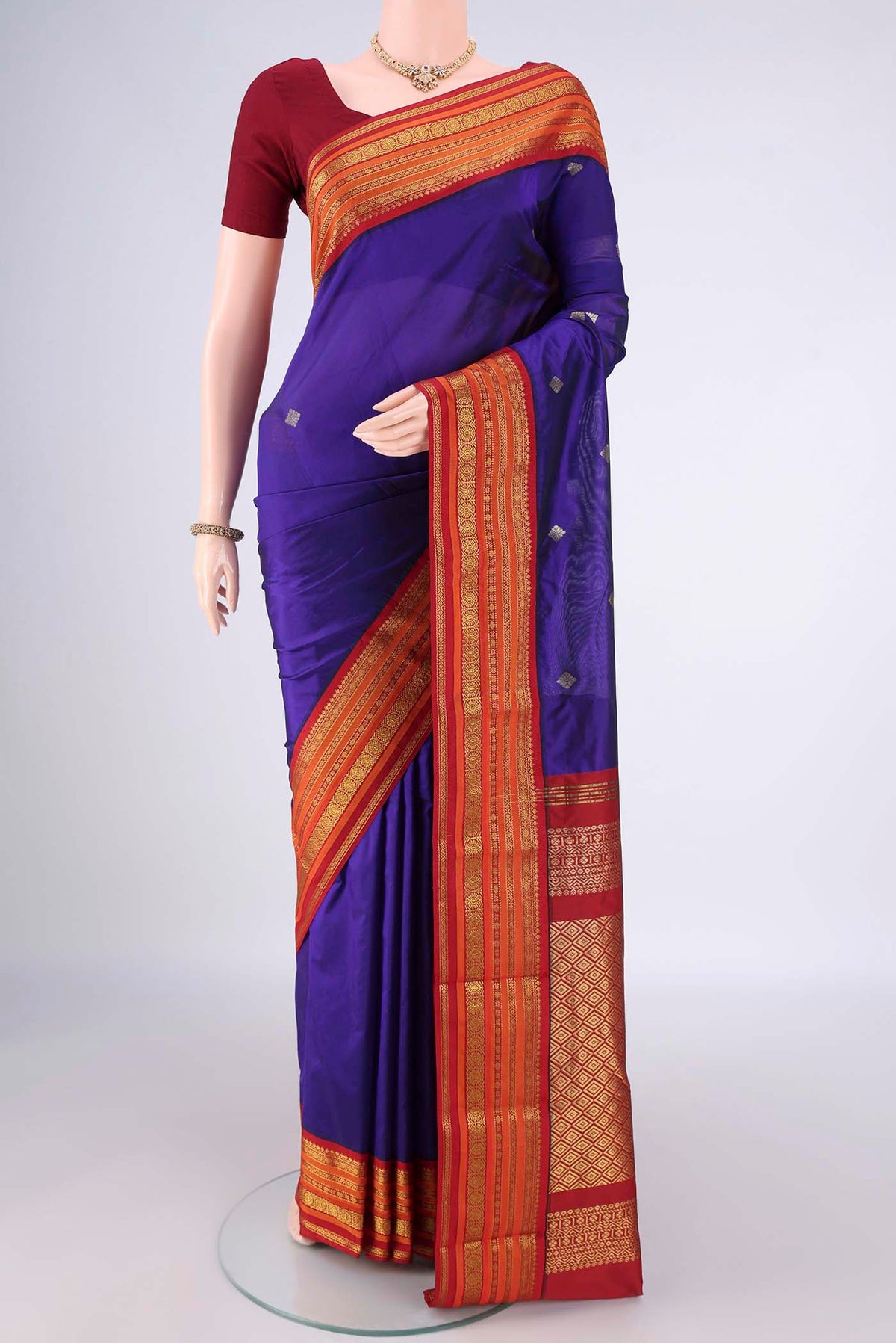 Navy Blue Blended Bangalore Silk Saree with Zari Butta on the body and Zari Border.  displayed on a mannequin